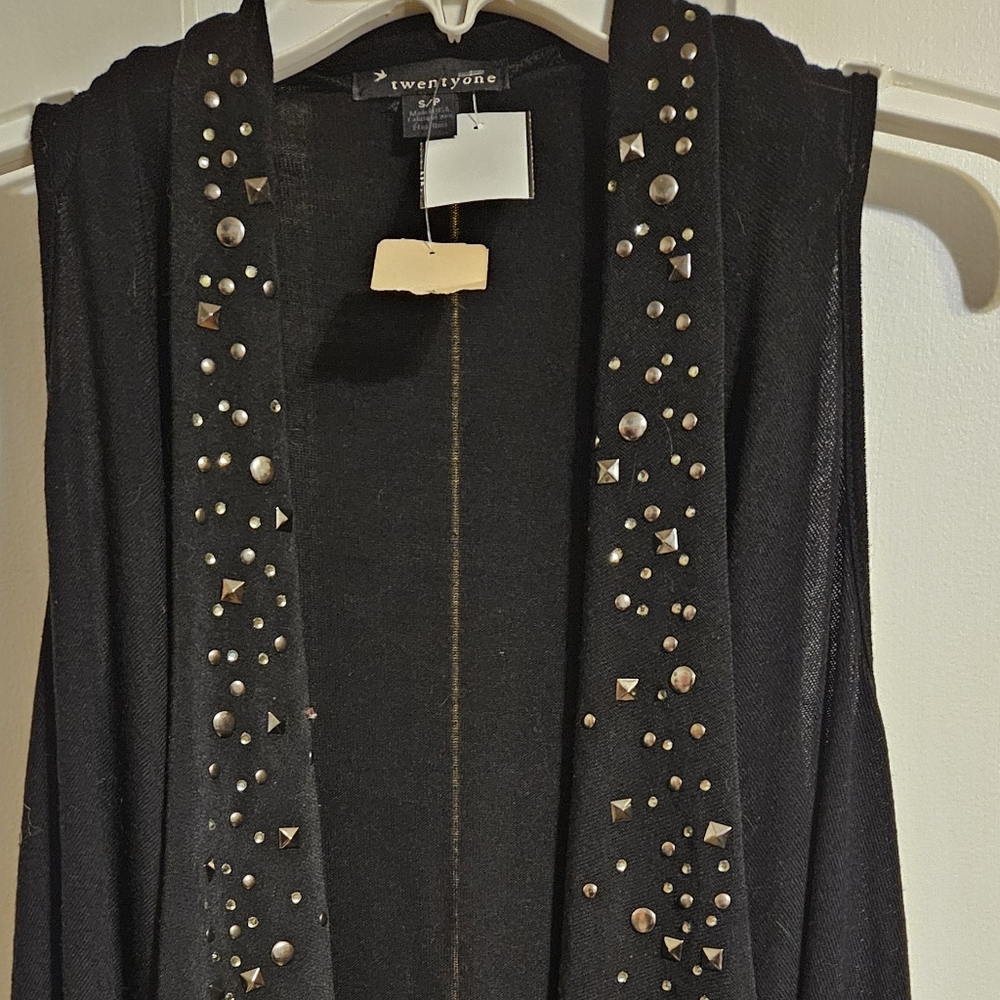 Twenty One studded sweater vest with geometric studs and sequins.